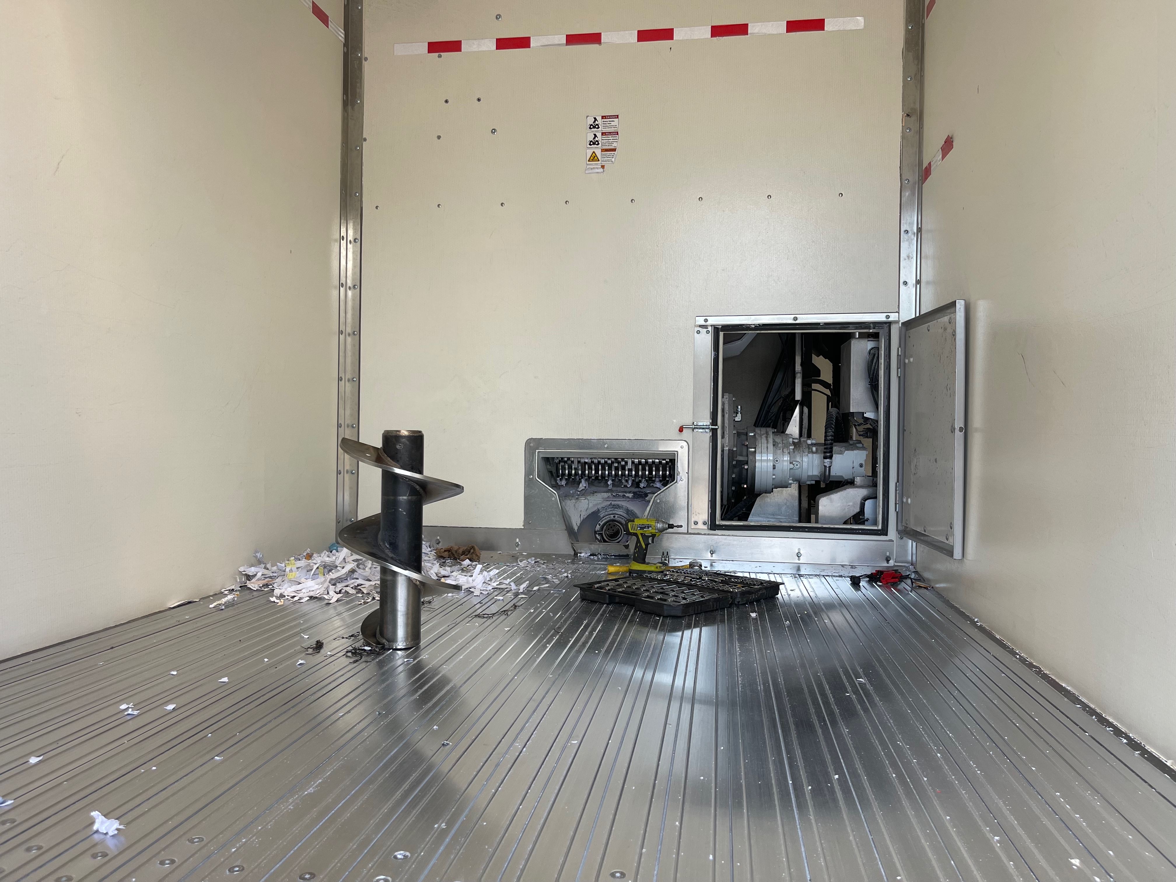 Inside a shred truck van body during service